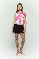 Pink croissant-shaped mini bag with shirt texture and adjustable sleeve handles for shoulder or crossbody wear