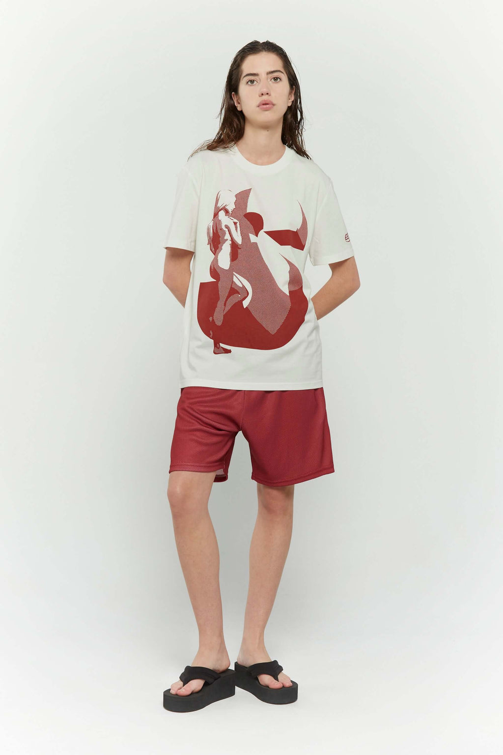 Off white t-shirt with female silhouette looking through large S graphic and SSSTUFFF logo detail on sleeve