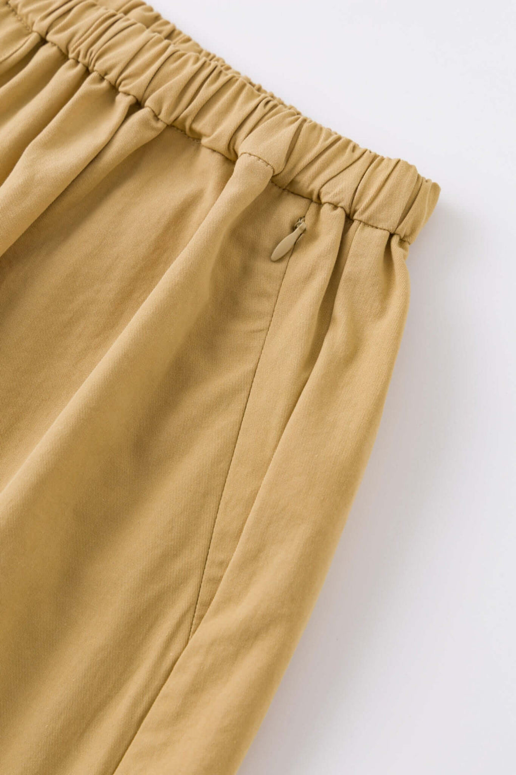 Beige boxer shorts with a red embroidery logo 
