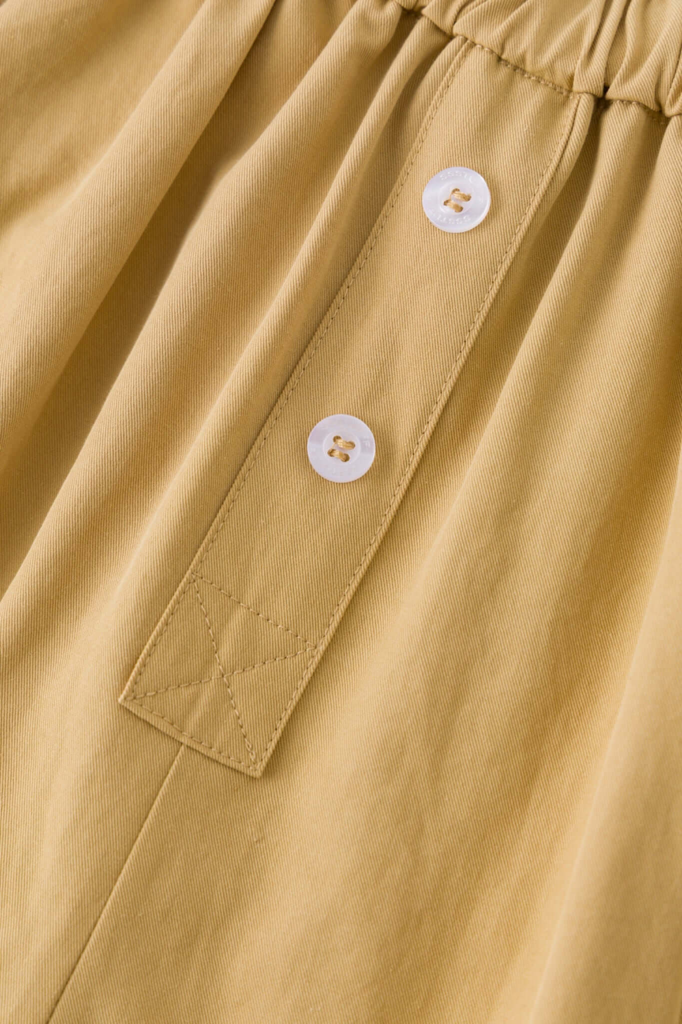 Beige boxer shorts with a red embroidery logo 