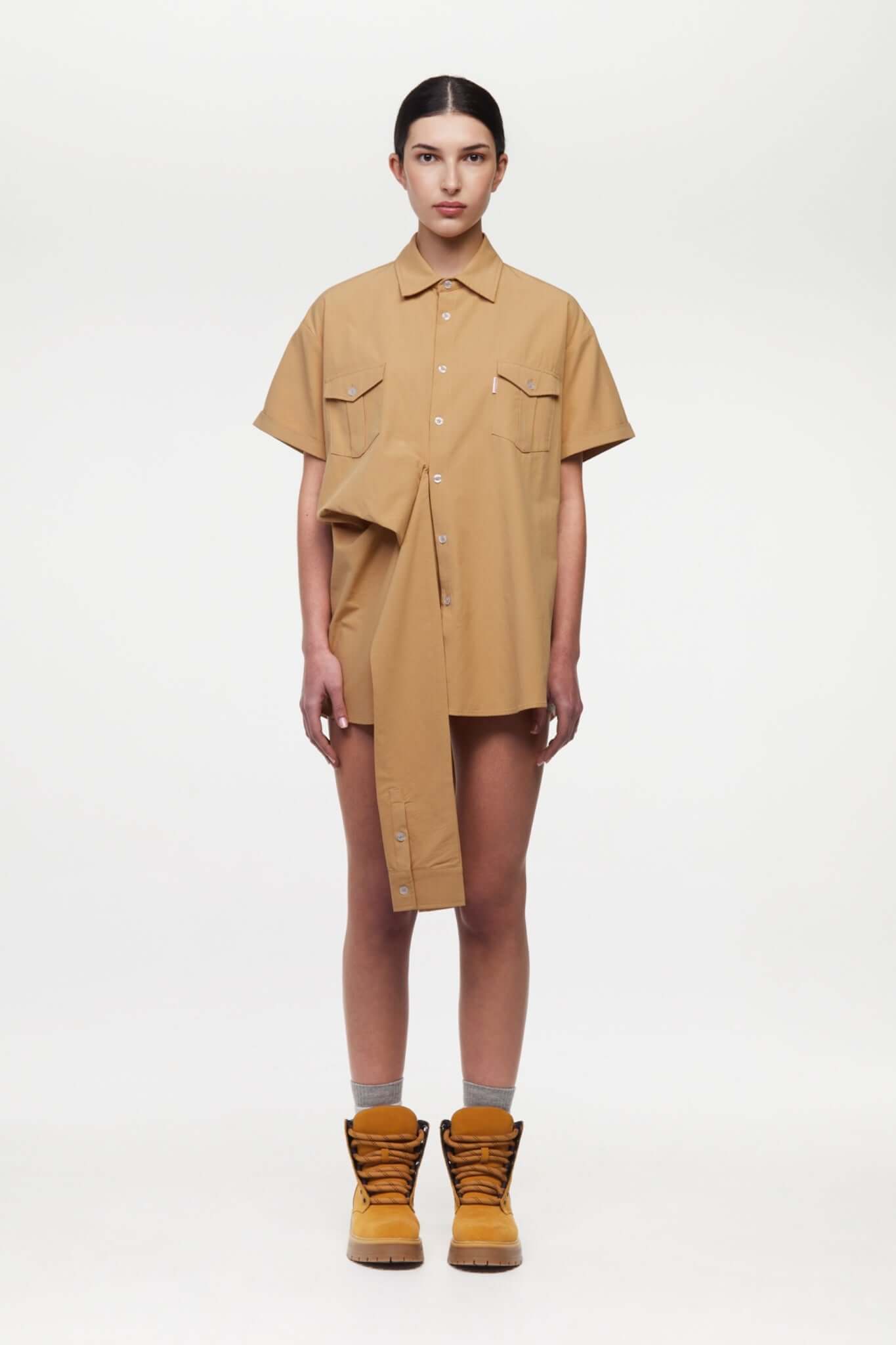 Beige shirt with 4 sleeves making a tie waist 