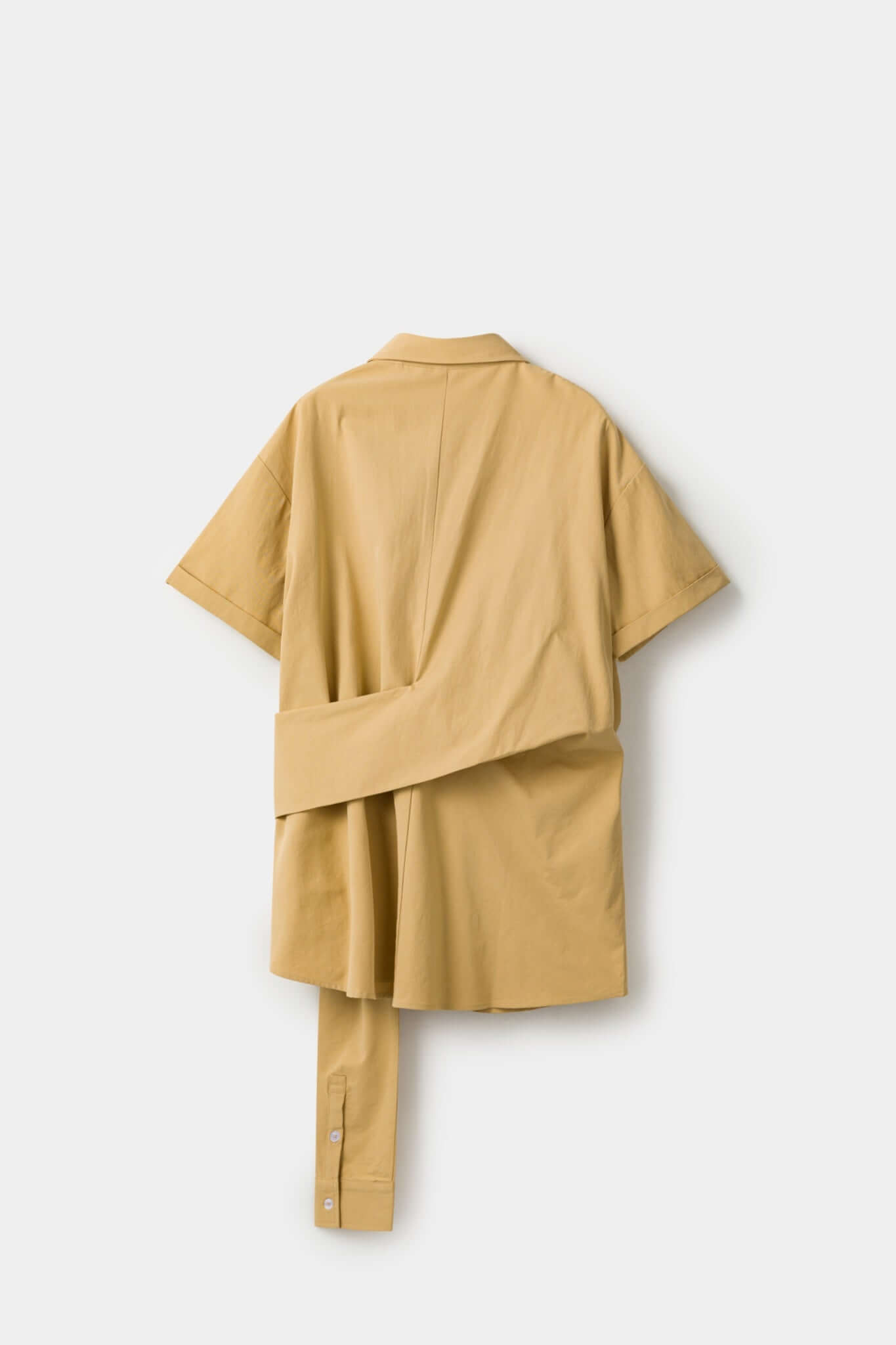 Beige shirt with 4 sleeves making a tie waist 
