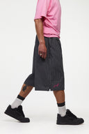 Black striped bermuda shorts with a logo embroidered
