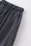 Black striped bermuda shorts with a logo embroidered
