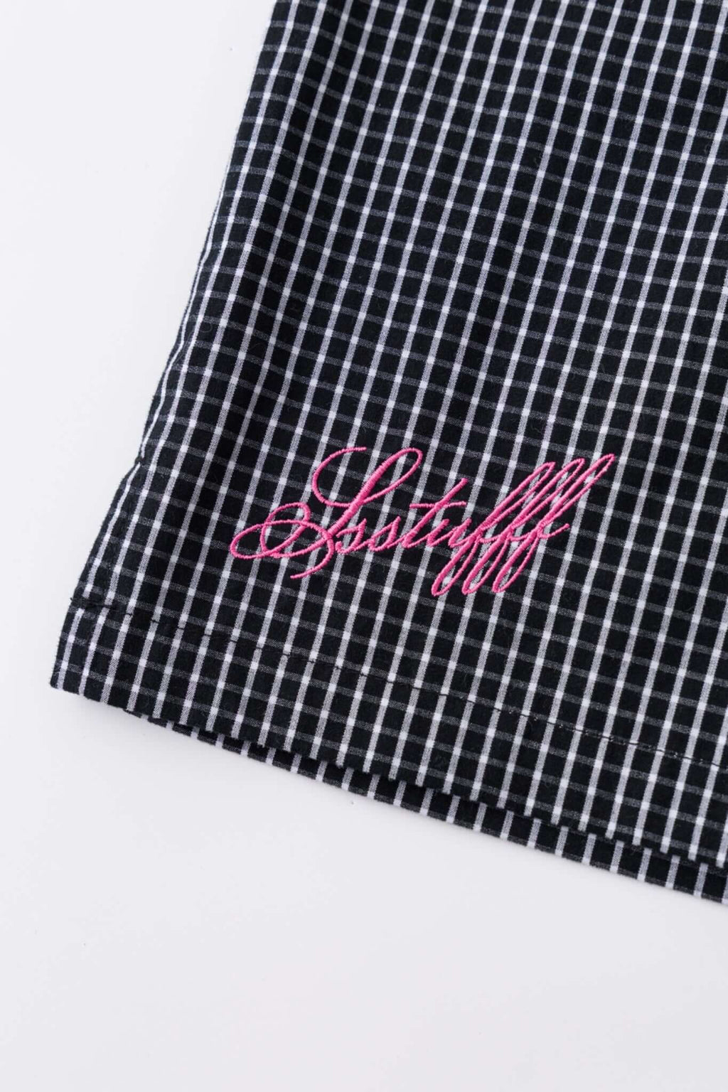 Black striped bermuda shorts with a logo embroidered
