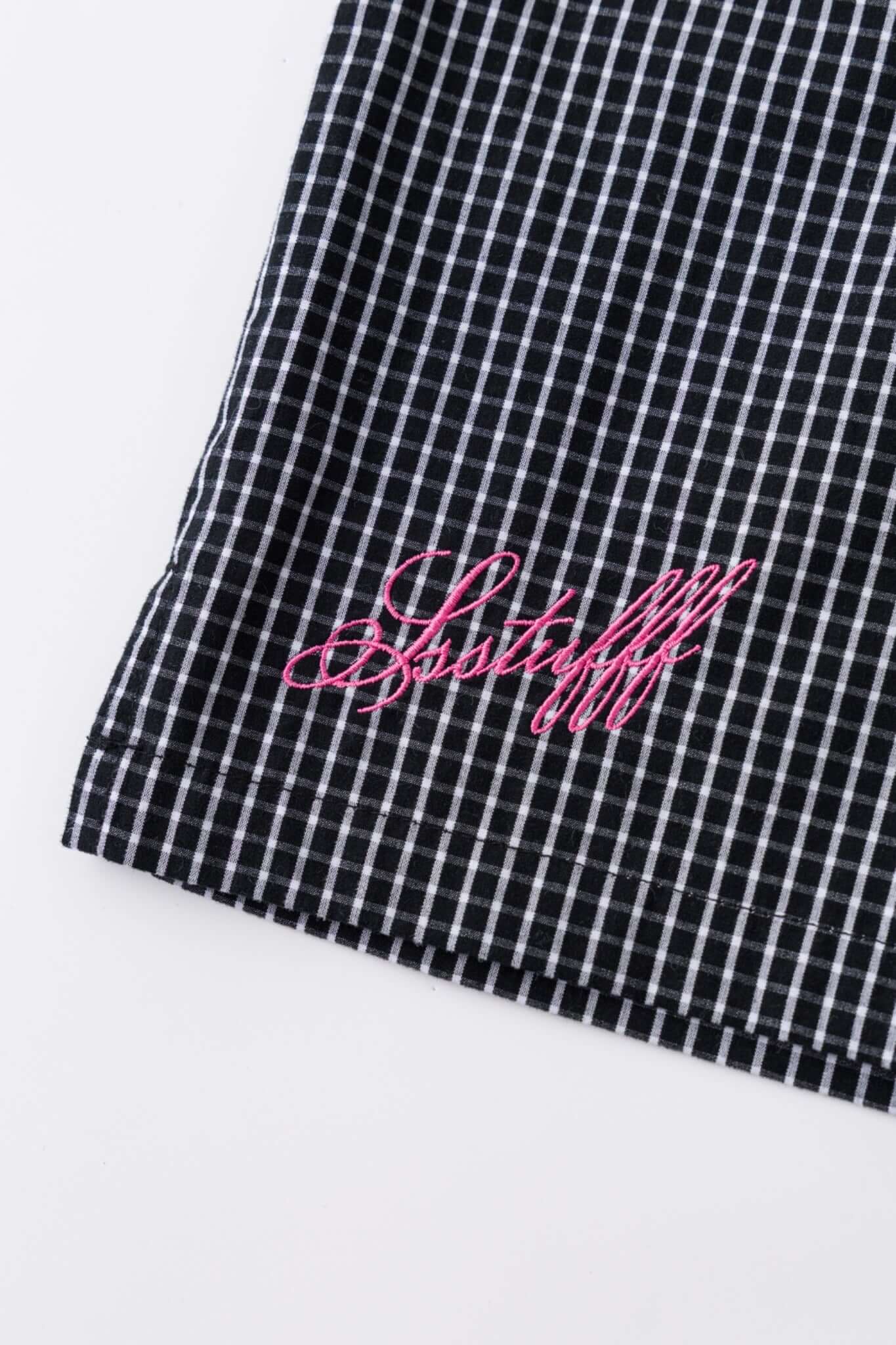 Black striped bermuda shorts with a logo embroidered
