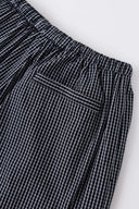 Black striped bermuda shorts with a logo embroidered
