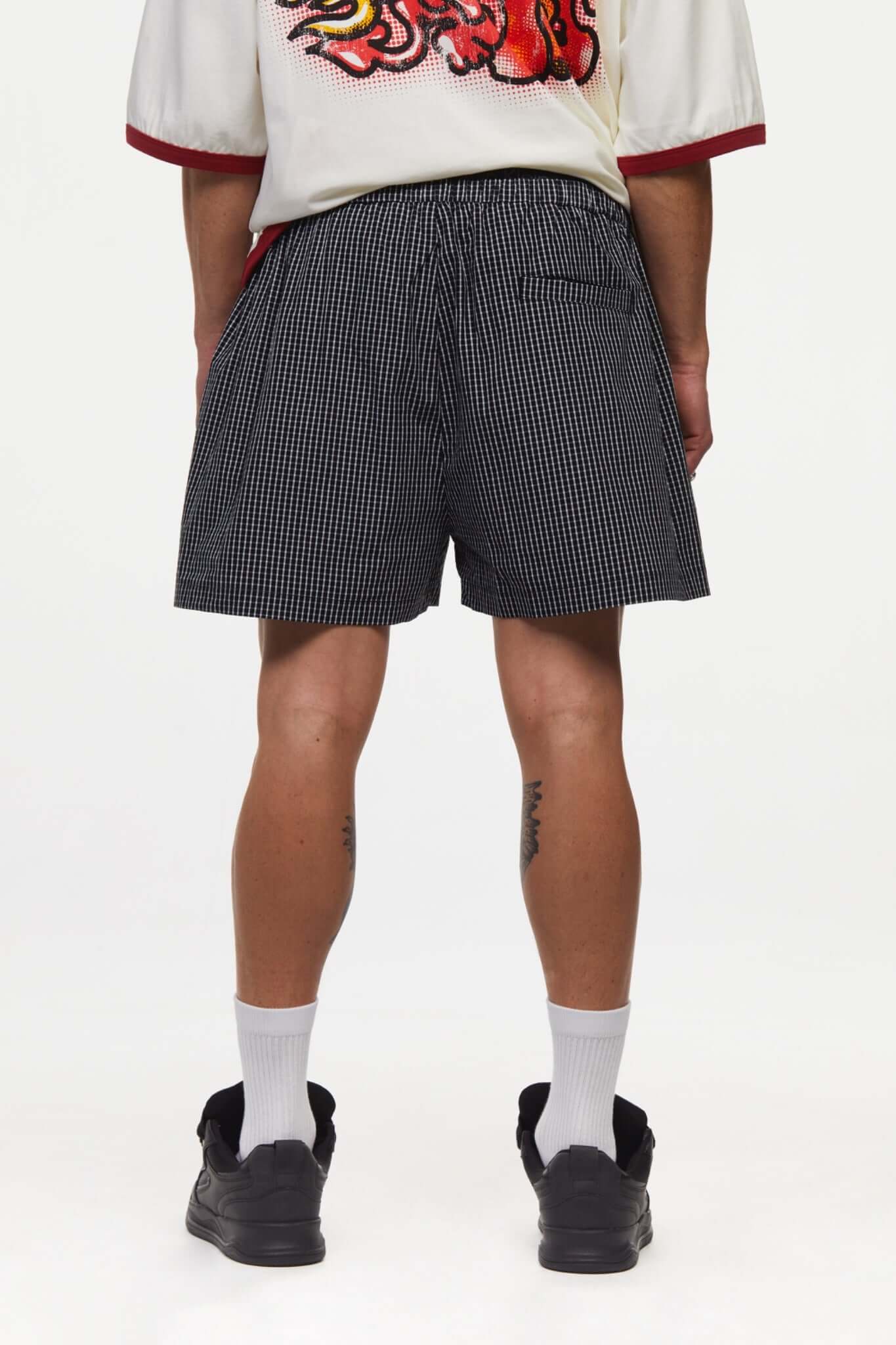 Black striped boxer shorts with a red embroidery logo 
