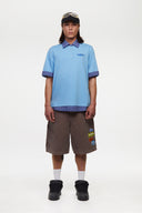 Blue polo shirt with checkered collar and sleeves