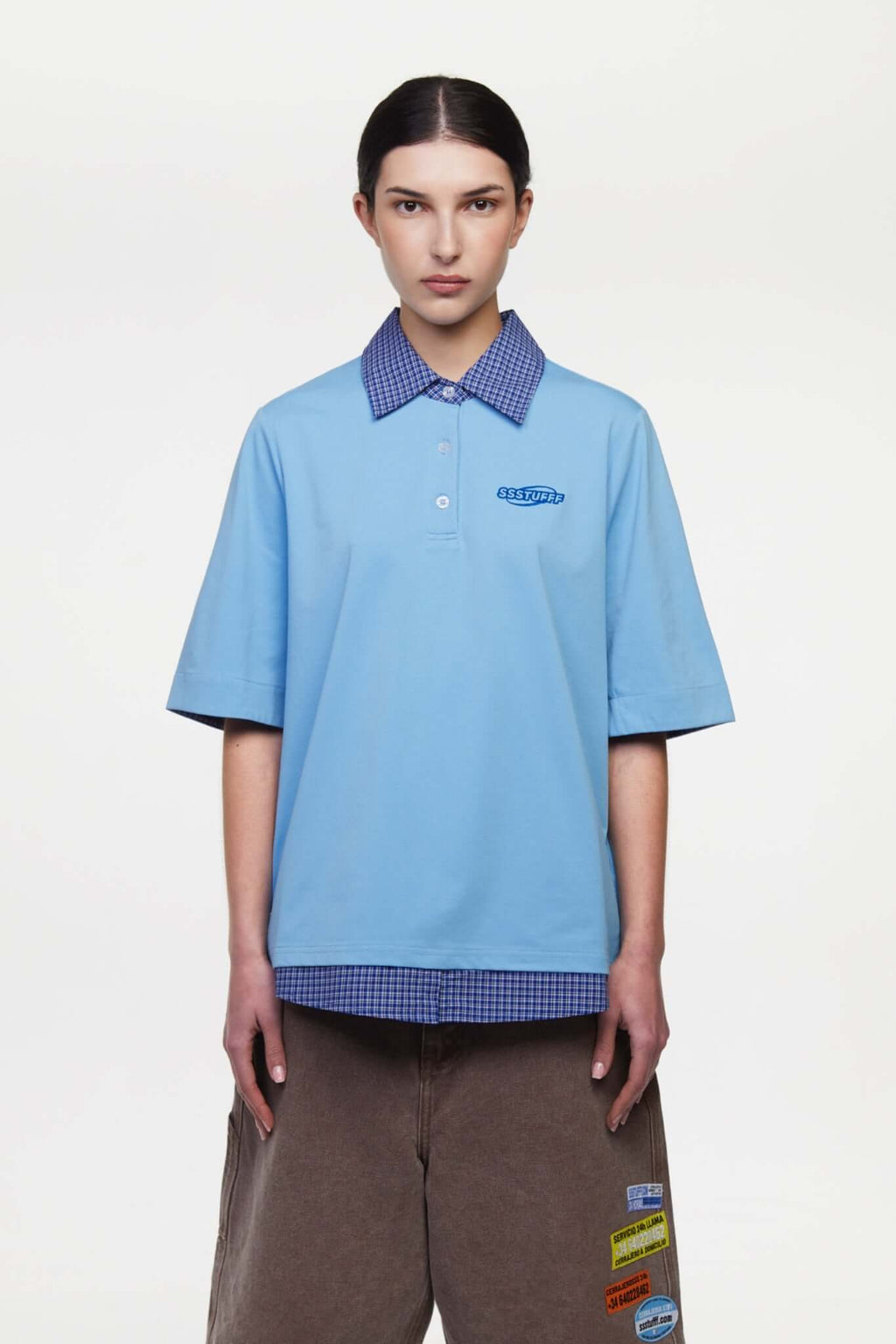 Blue polo shirt with checkered collar and sleeves
