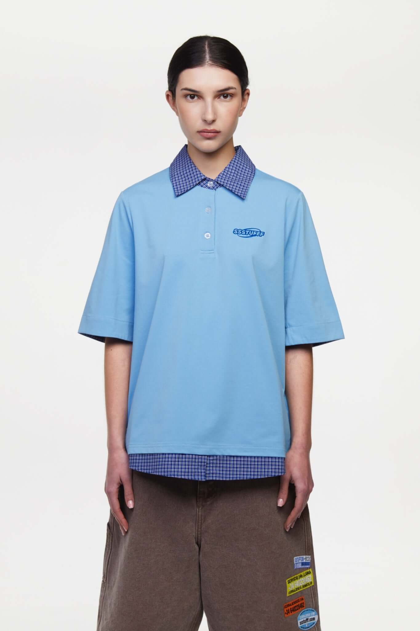 Blue polo shirt with checkered collar and sleeves
