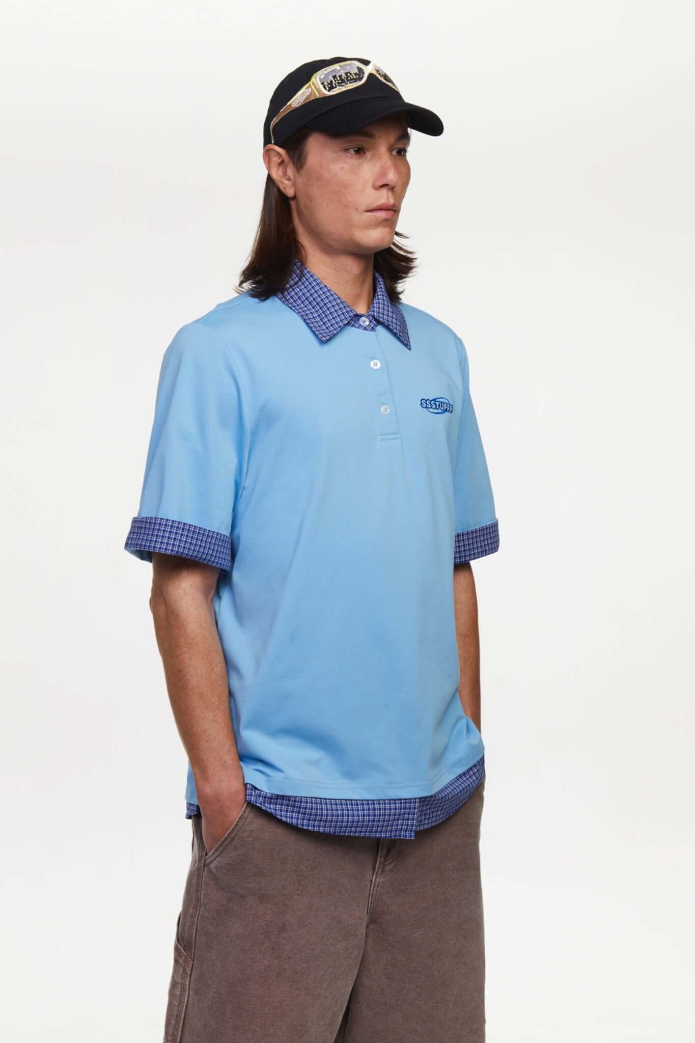 Blue polo shirt with checkered collar and sleeves
