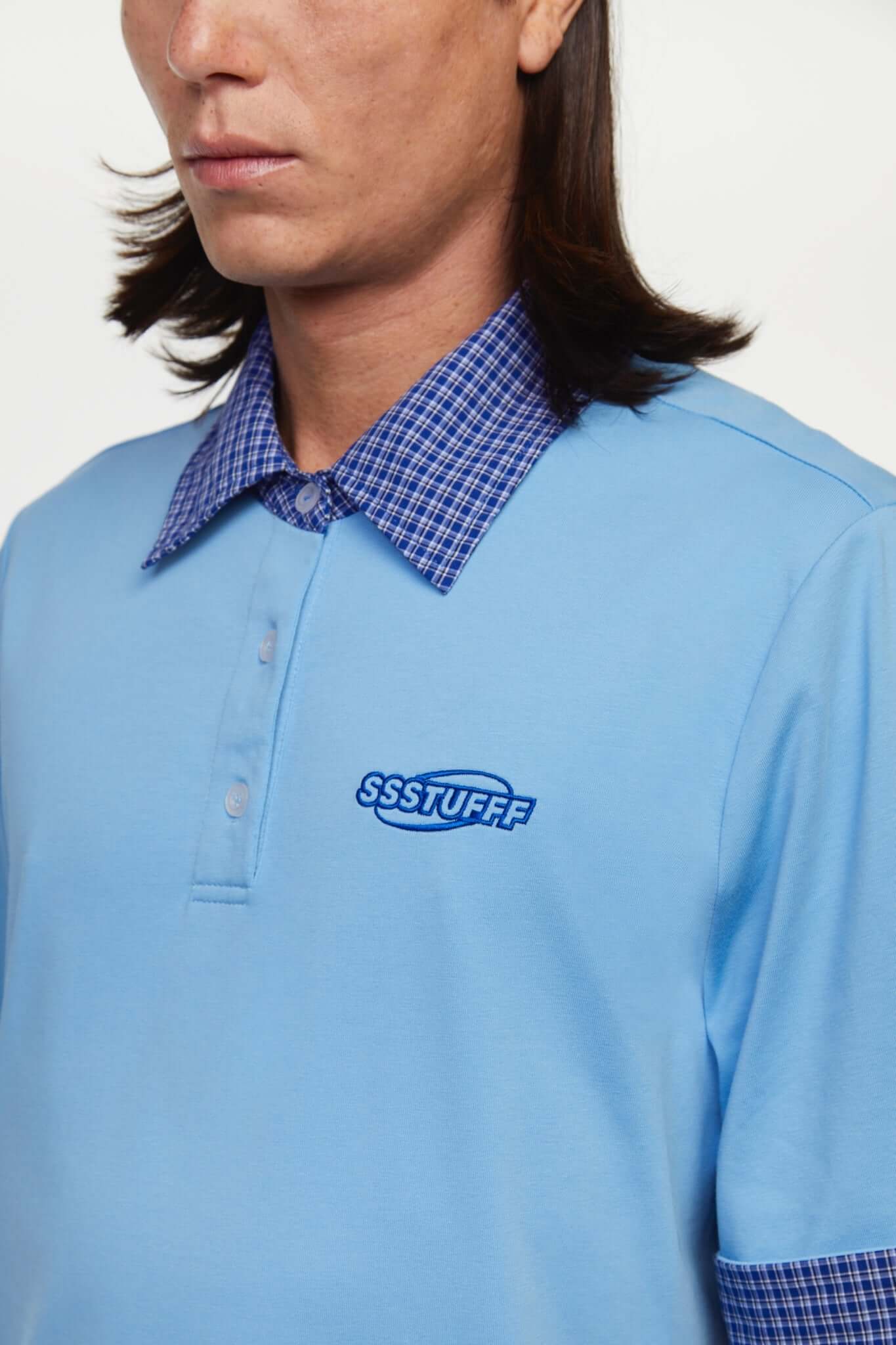 Blue polo shirt with checkered collar and sleeves
