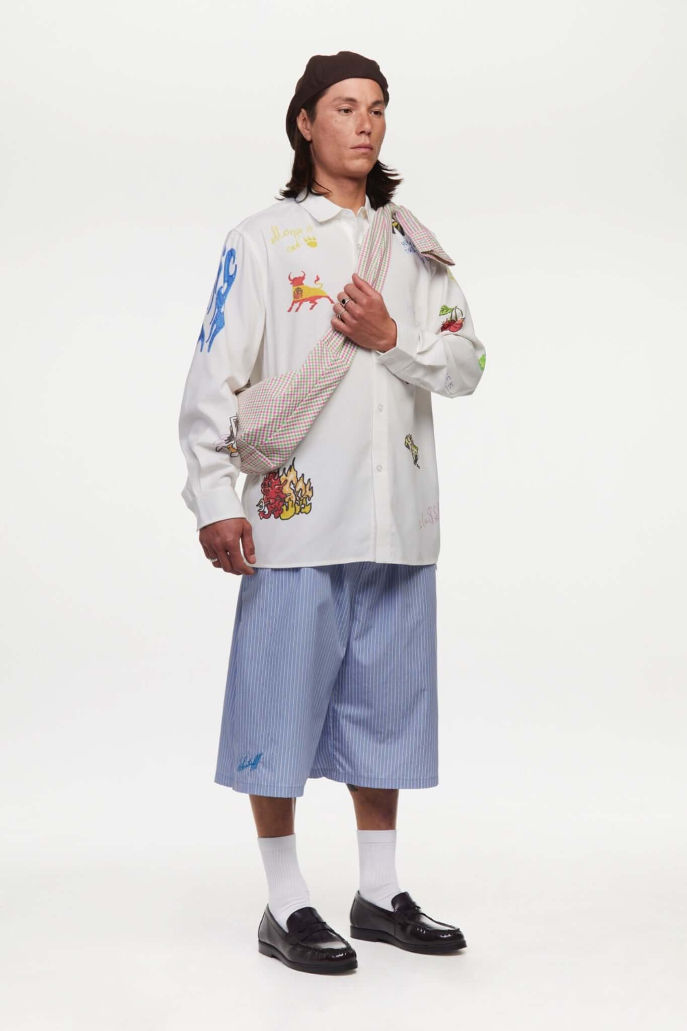 Blue striped bermuda shorts with a logo embroidered