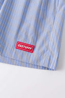 Blue striped boxer shorts with a red embroidery logo 
