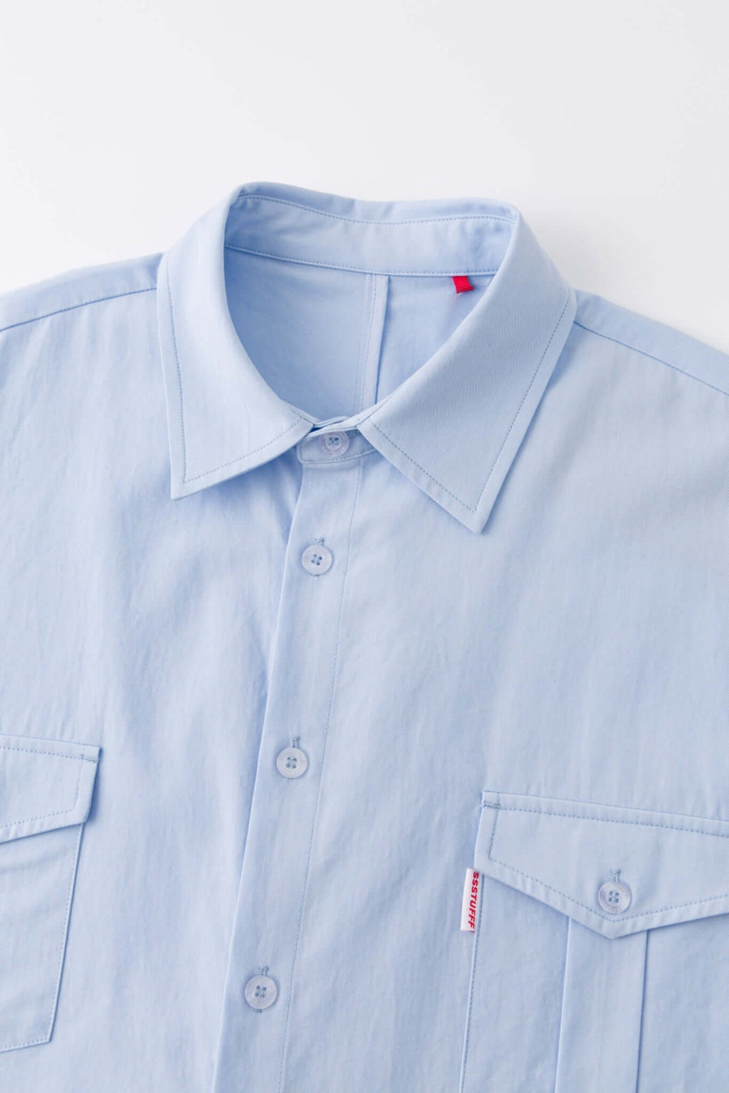 Blue shirt with 4 sleeves making a tie waist 
