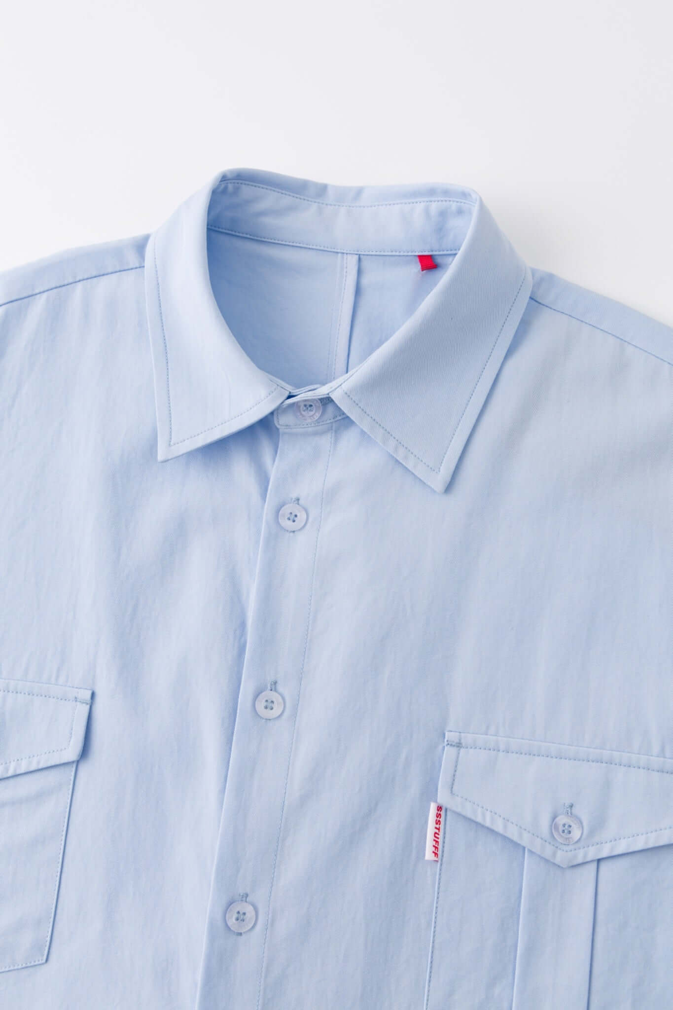 Blue shirt with 4 sleeves making a tie waist 
