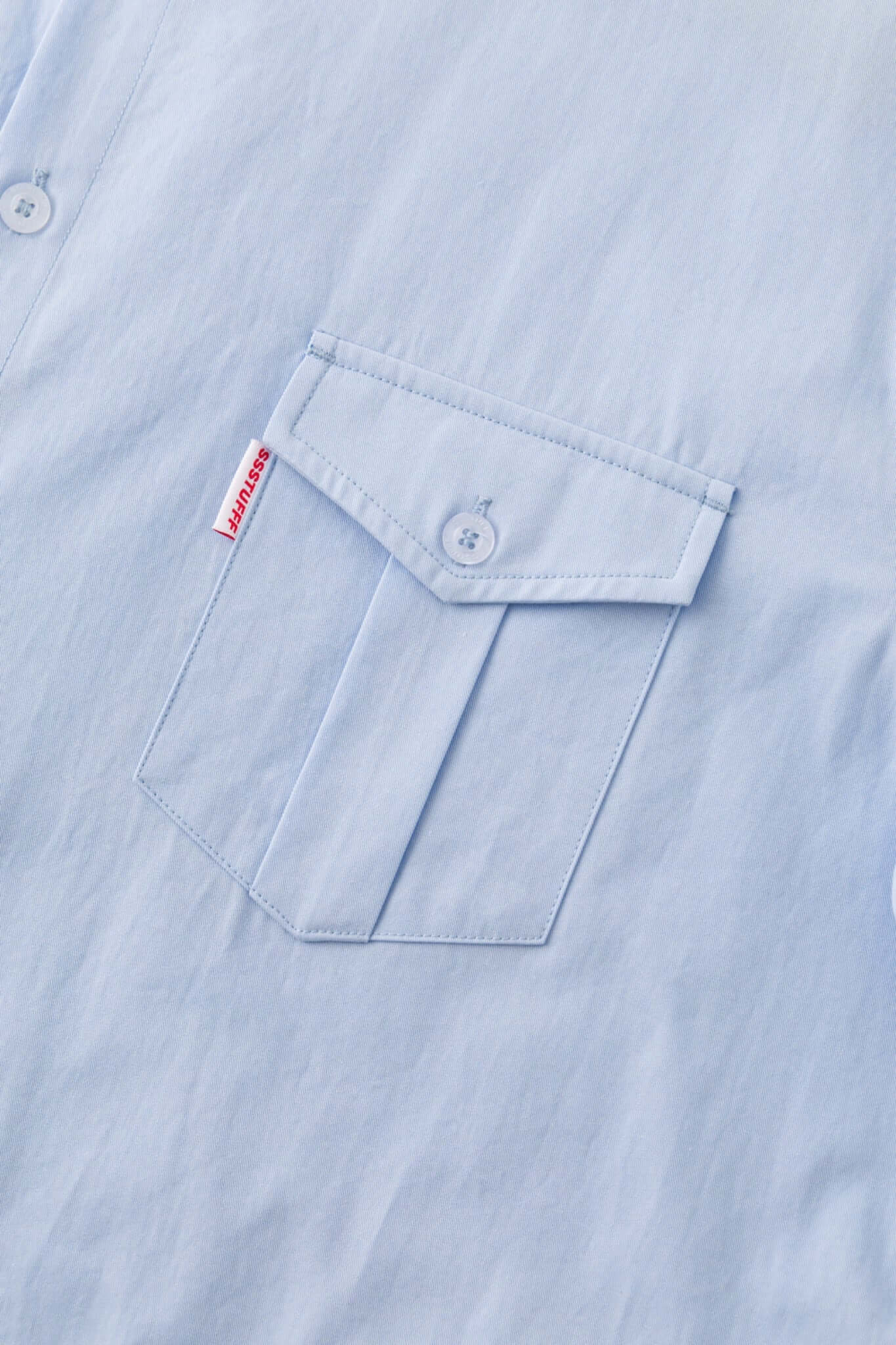 Blue shirt with 4 sleeves making a tie waist 
