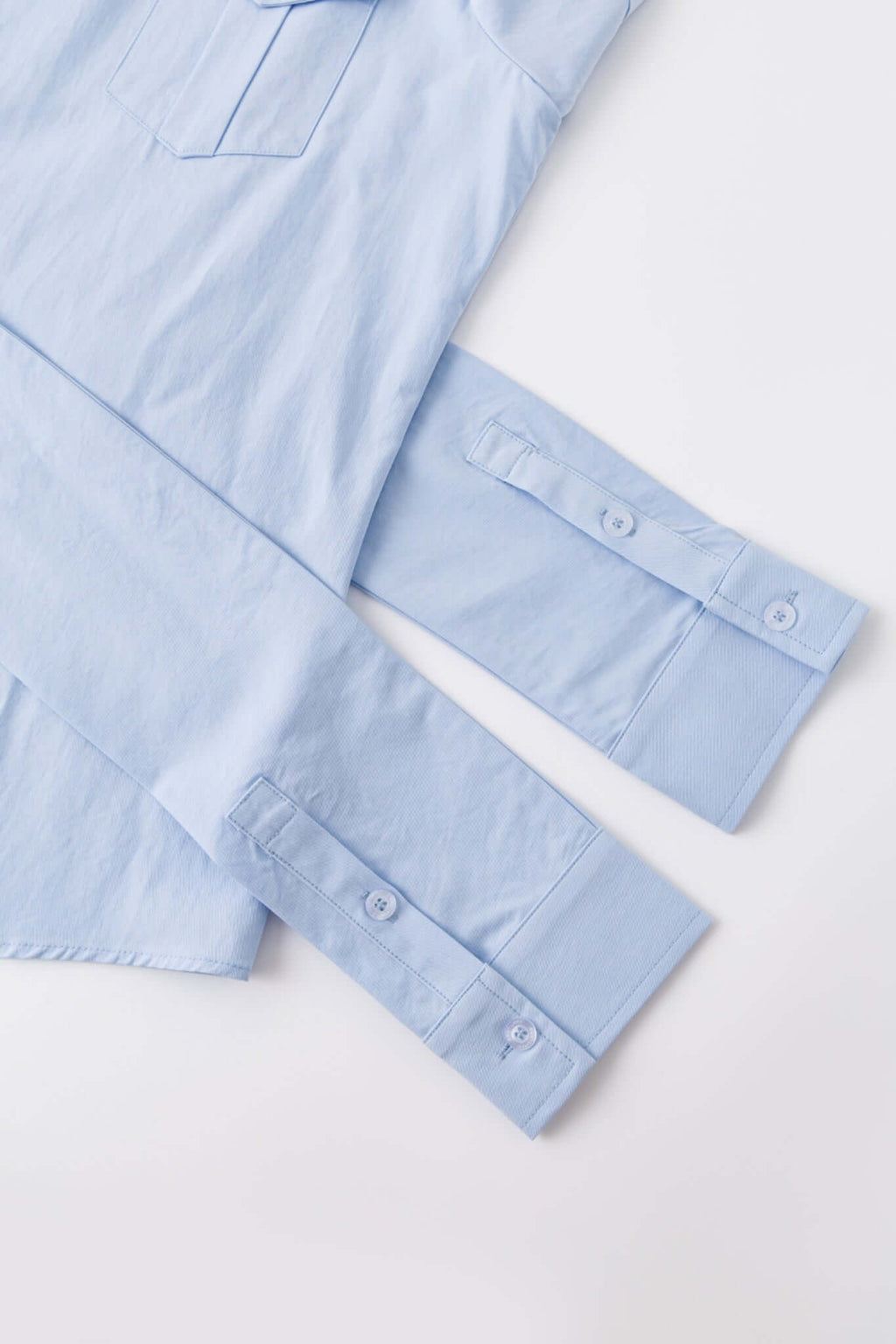 Blue shirt with 4 sleeves making a tie waist 
