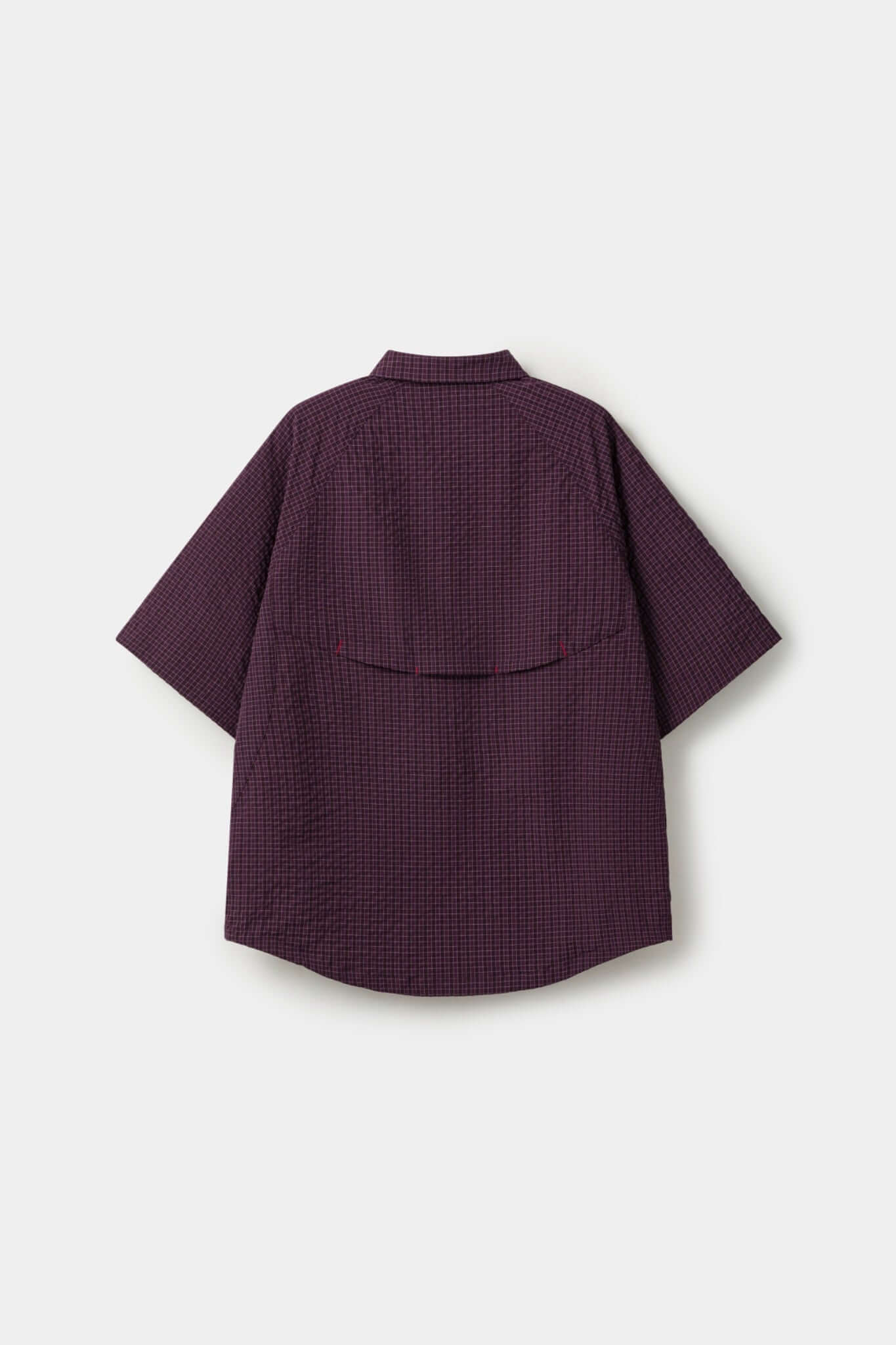 Burgundy checkered shirt with a red logo and red details in the zipper
