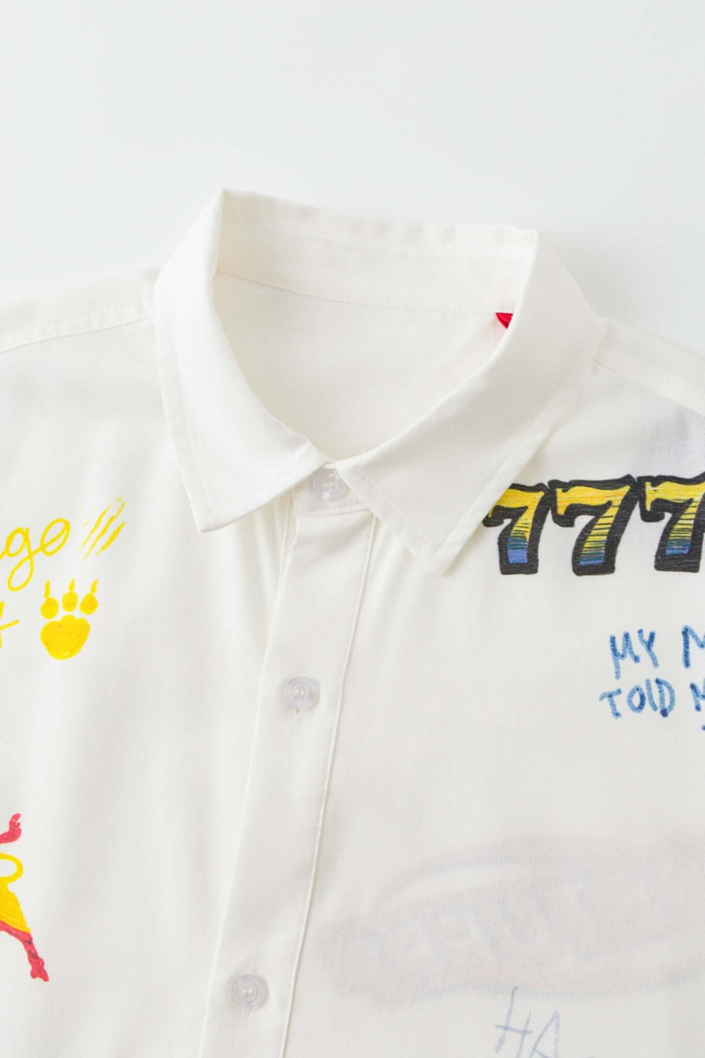 White shirt with colorful graphics simulating a plaster 
