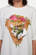 White t-shirt with a graphic of a flower shop cone that you can break 
