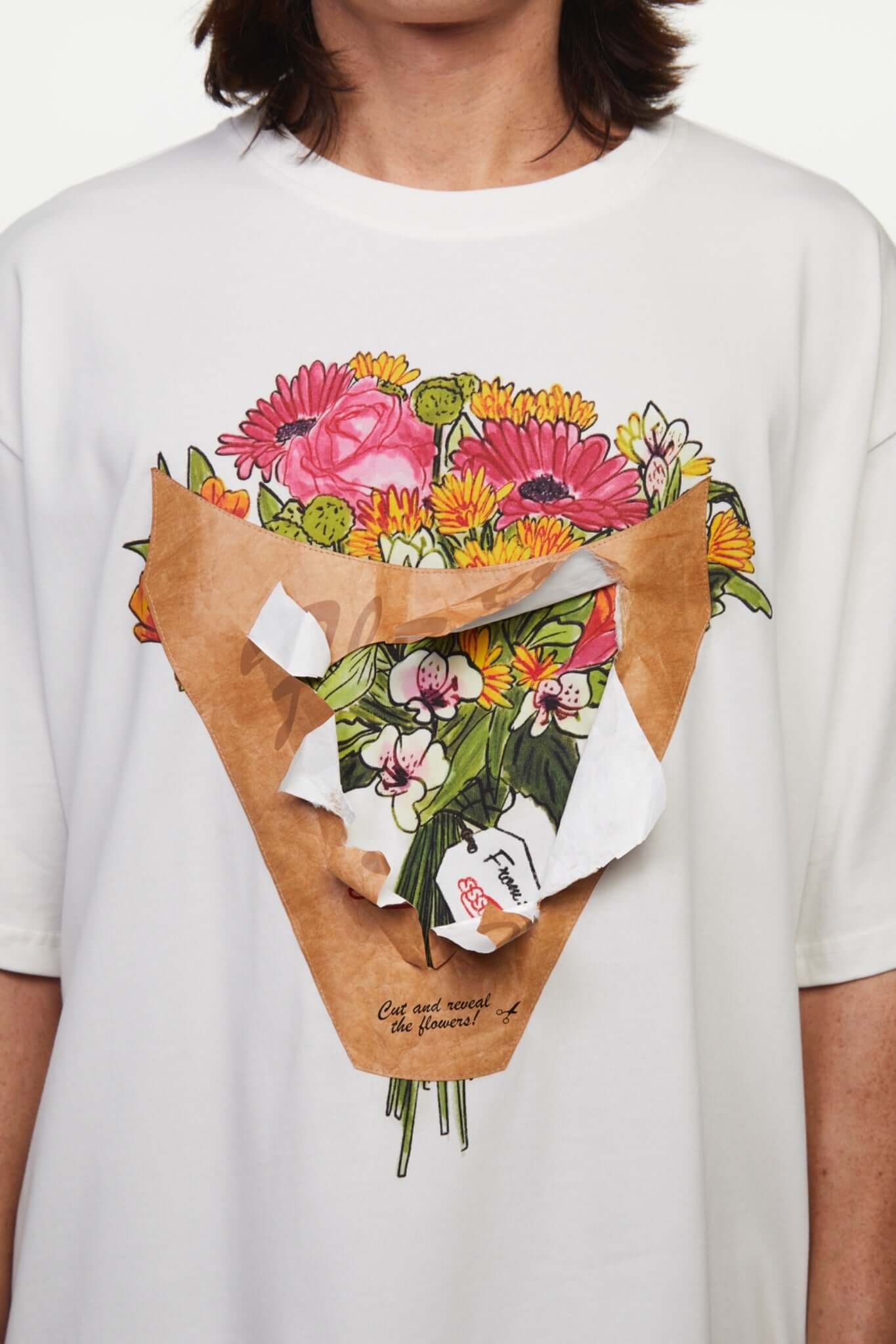 White t-shirt with a graphic of a flower shop cone that you can break 
