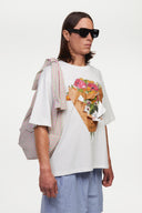 White t-shirt with a graphic of a flower shop cone that you can break 
