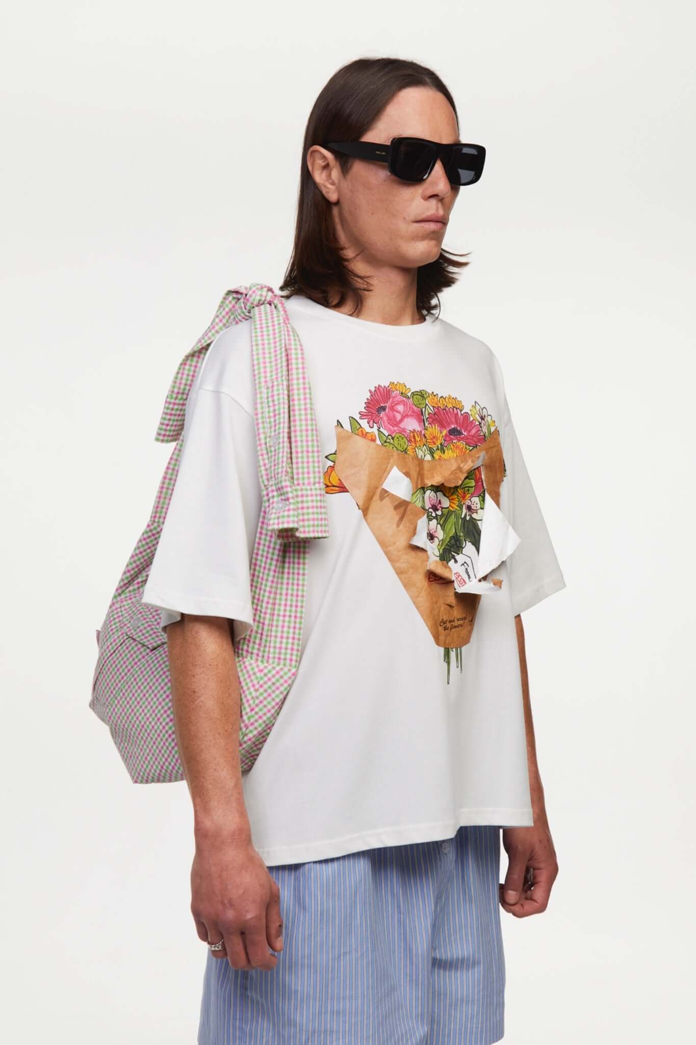 White t-shirt with a graphic of a flower shop cone that you can break 
