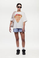 White t-shirt with a graphic of a flower shop cone that you can break 
