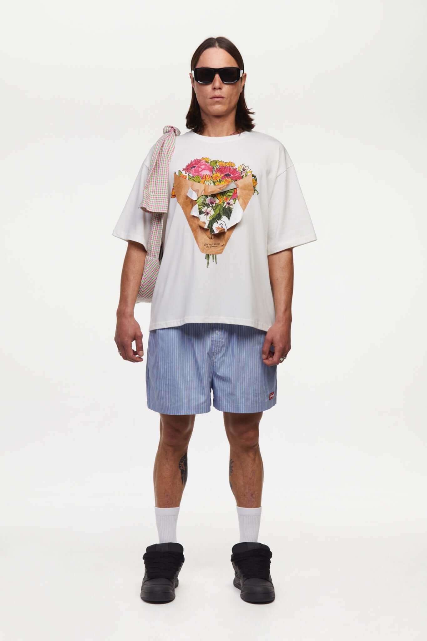 White t-shirt with a graphic of a flower shop cone that you can break 
