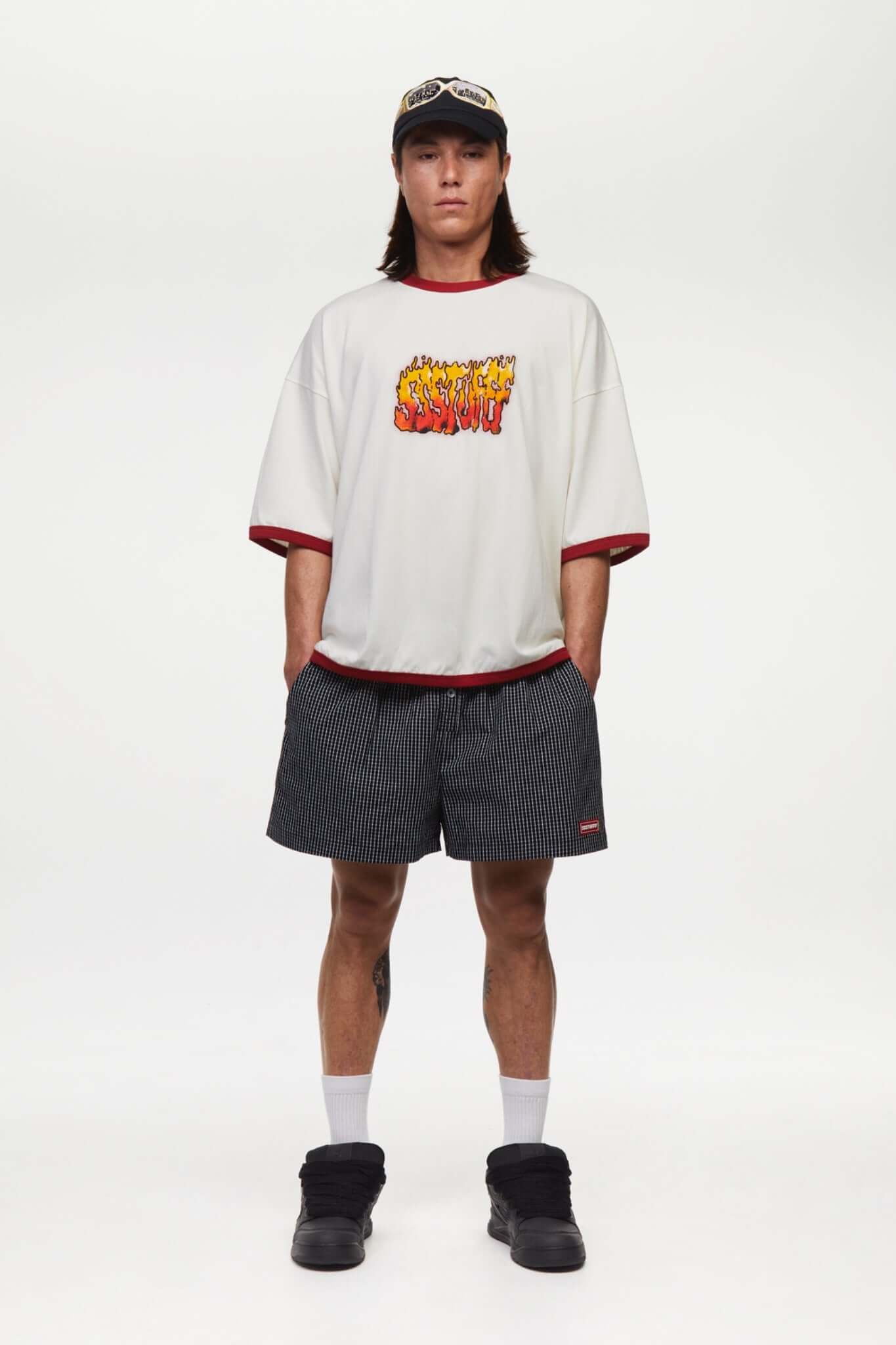 White t-shirt with red trim and fire yellow and red graphic
