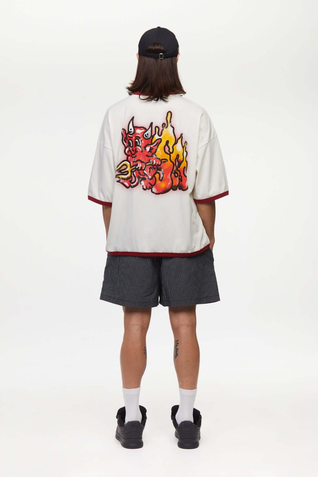 White t-shirt with red trim and fire yellow and red graphic
