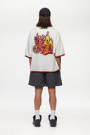 White t-shirt with red trim and fire yellow and red graphic
