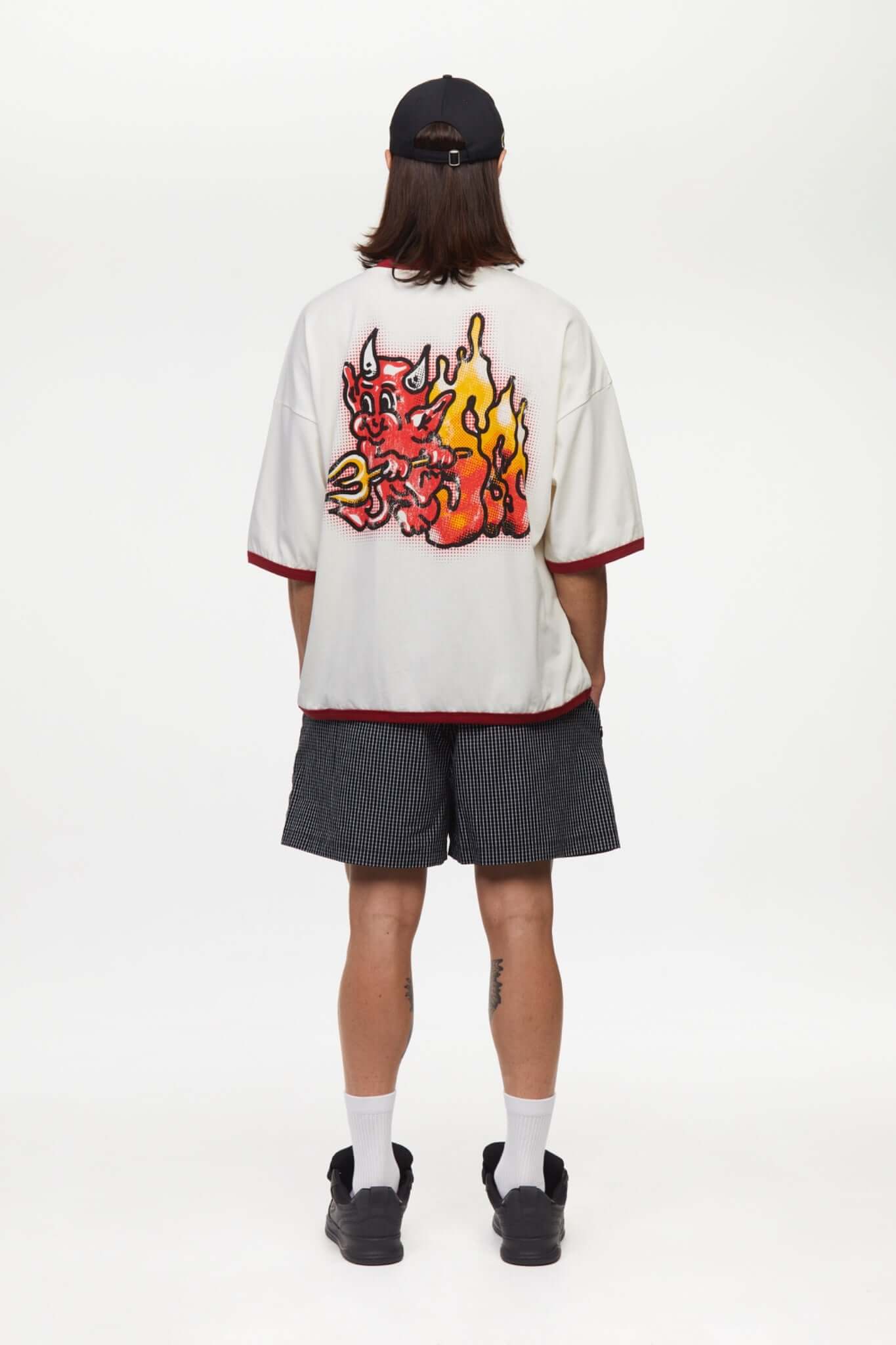 White t-shirt with red trim and fire yellow and red graphic
