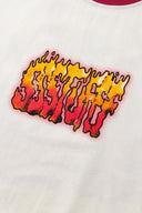 White t-shirt with red trim and fire yellow and red graphic
