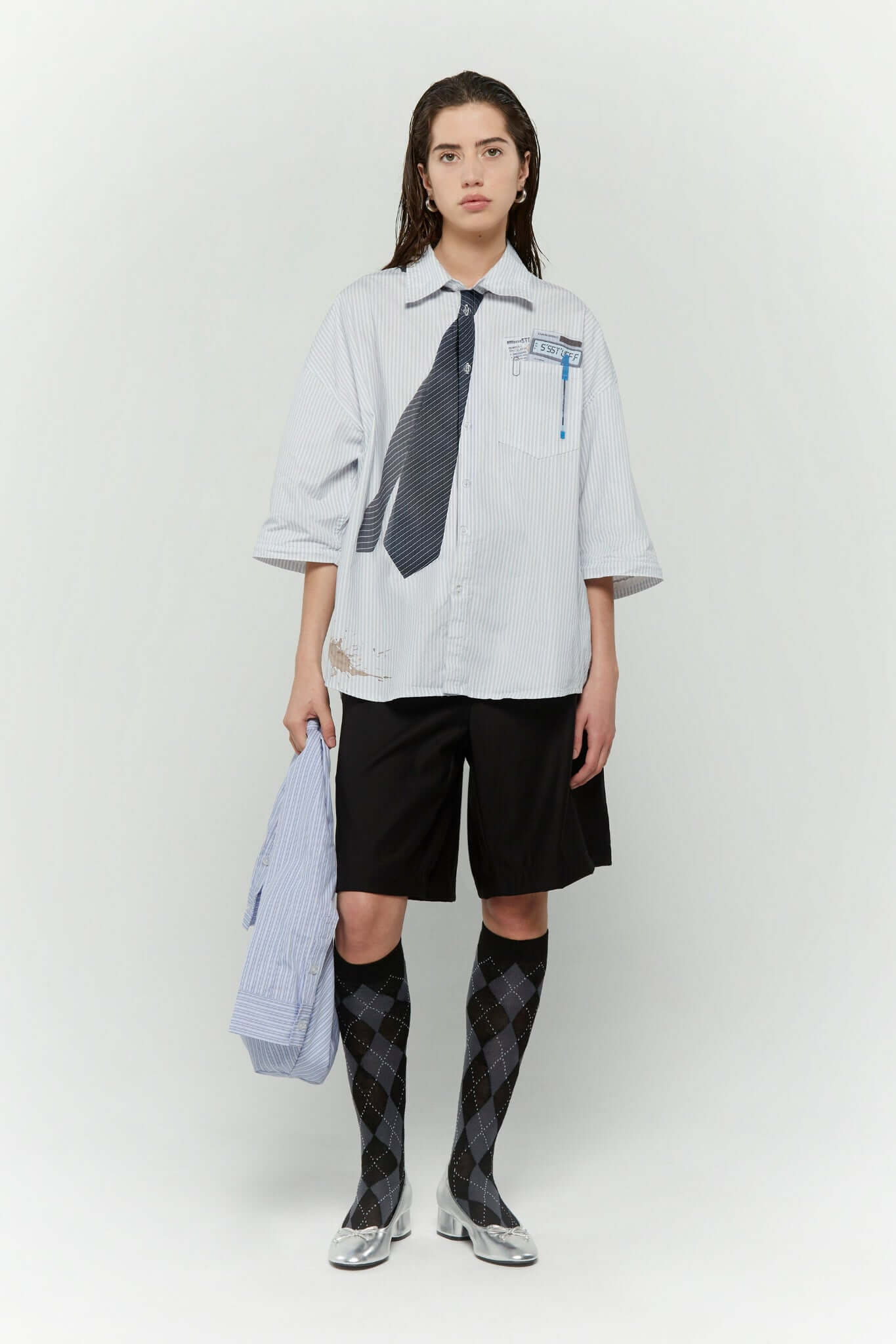 Light blue stripes shirt with a black tie graphic 
