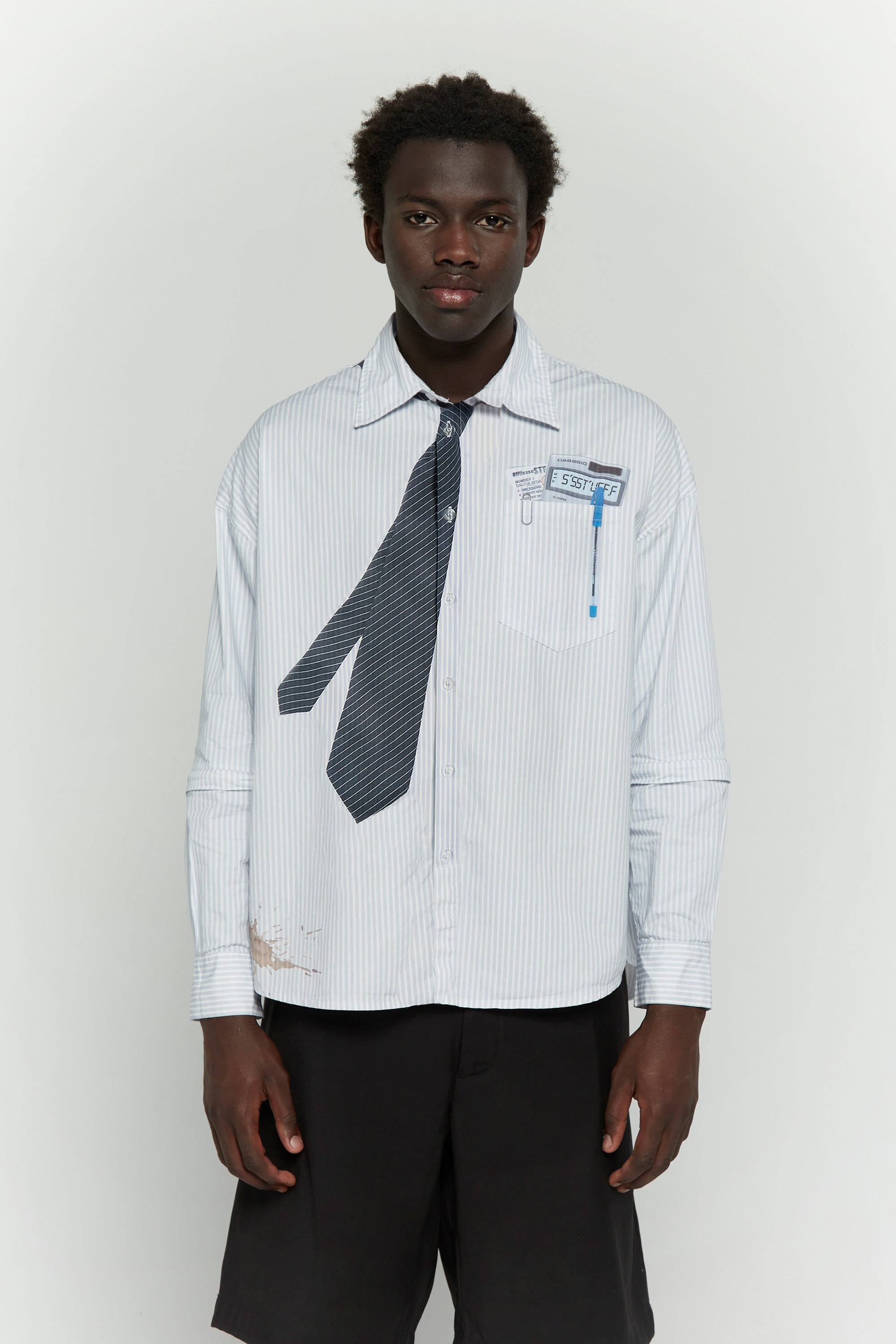 Light blue stripes shirt with a black tie graphic 

