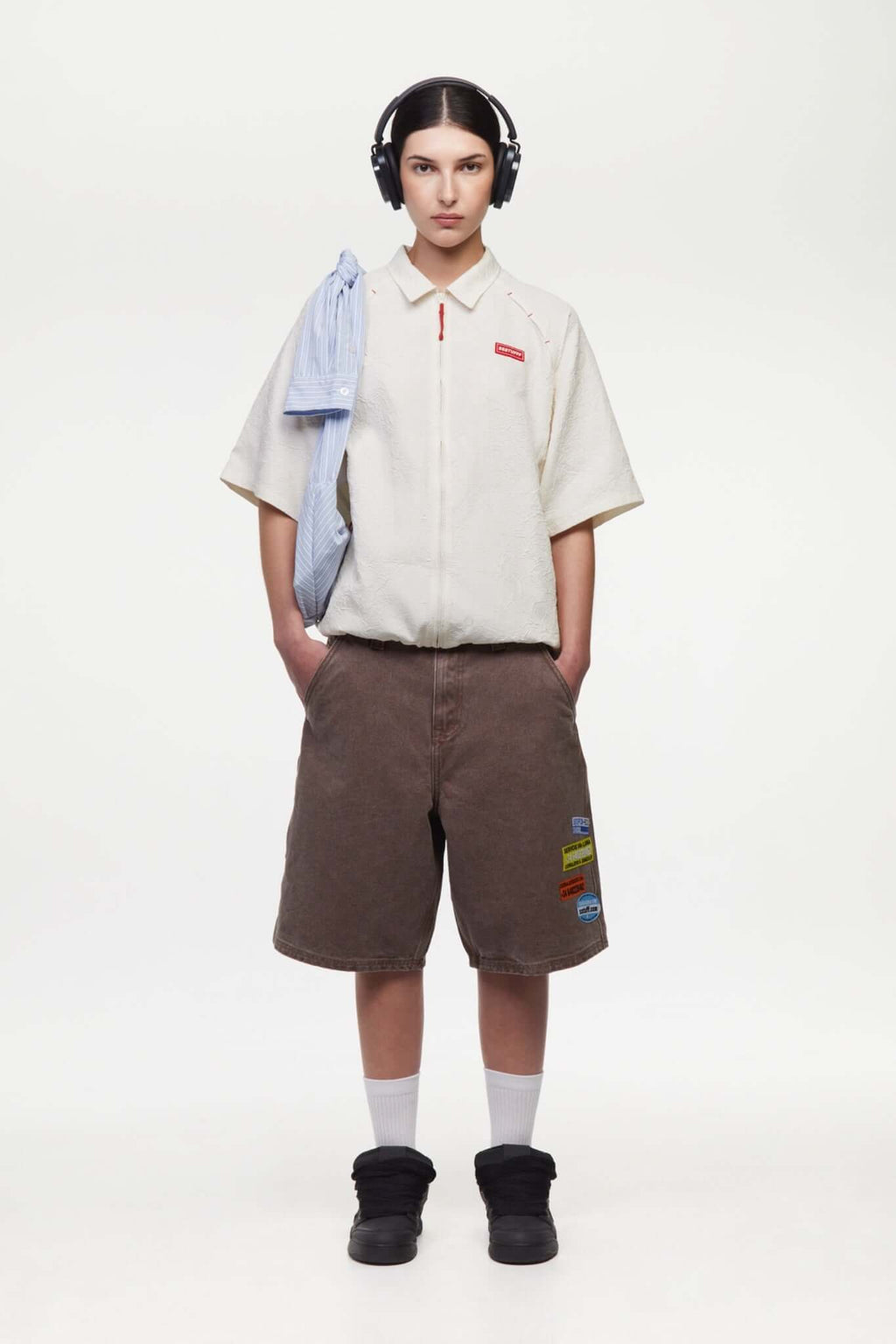 Brown denim shorts with vinyl patches 
