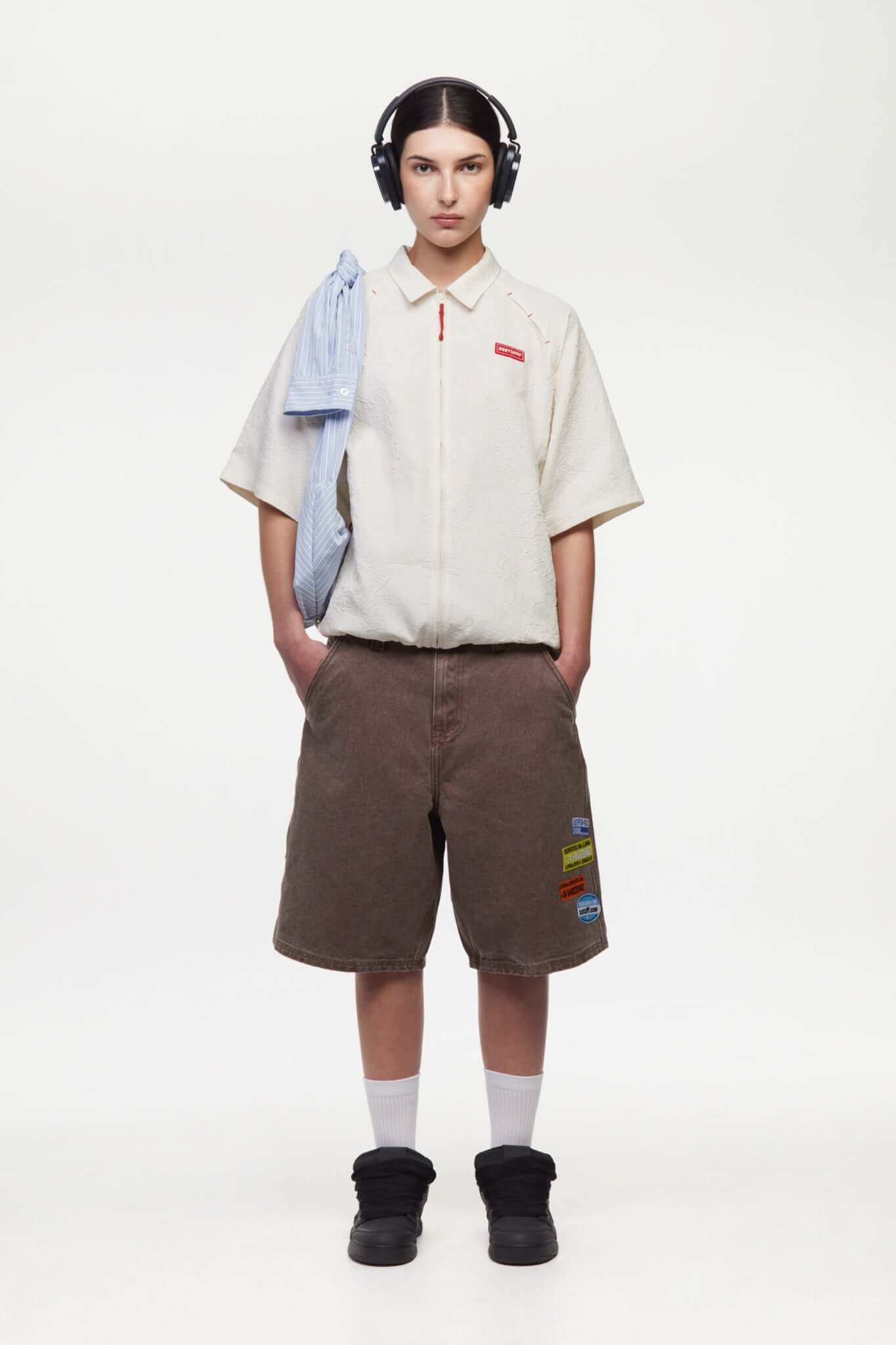 Brown denim shorts with vinyl patches 
