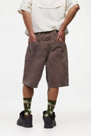 Brown denim shorts with vinyl patches
