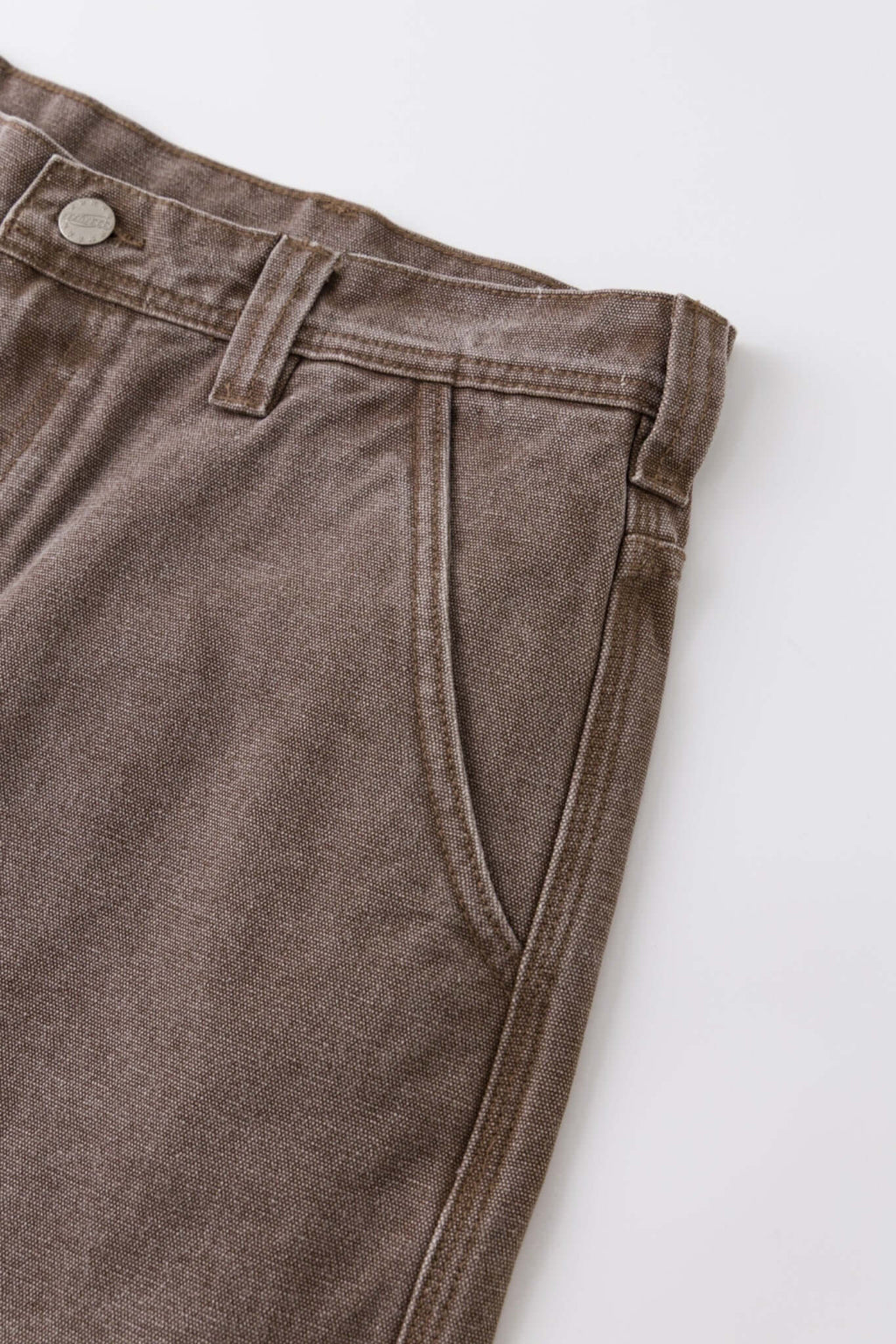 Brown denim shorts with vinyl patches

