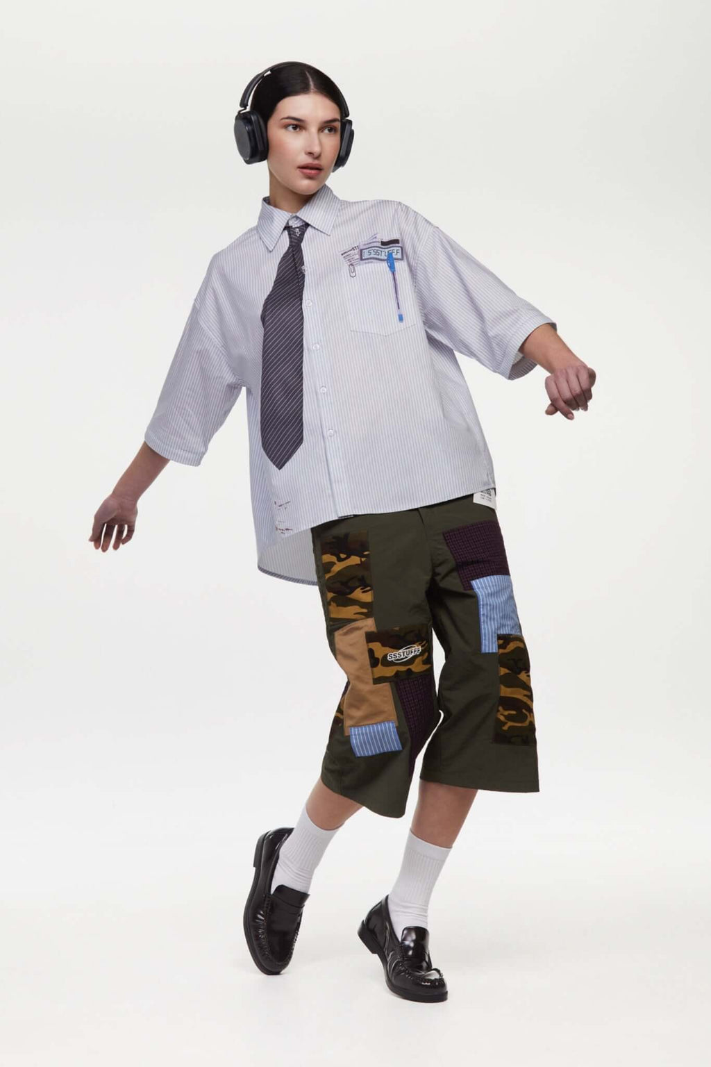 Green patchwork pants with various patterns 