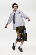 Green patchwork pants with various patterns 