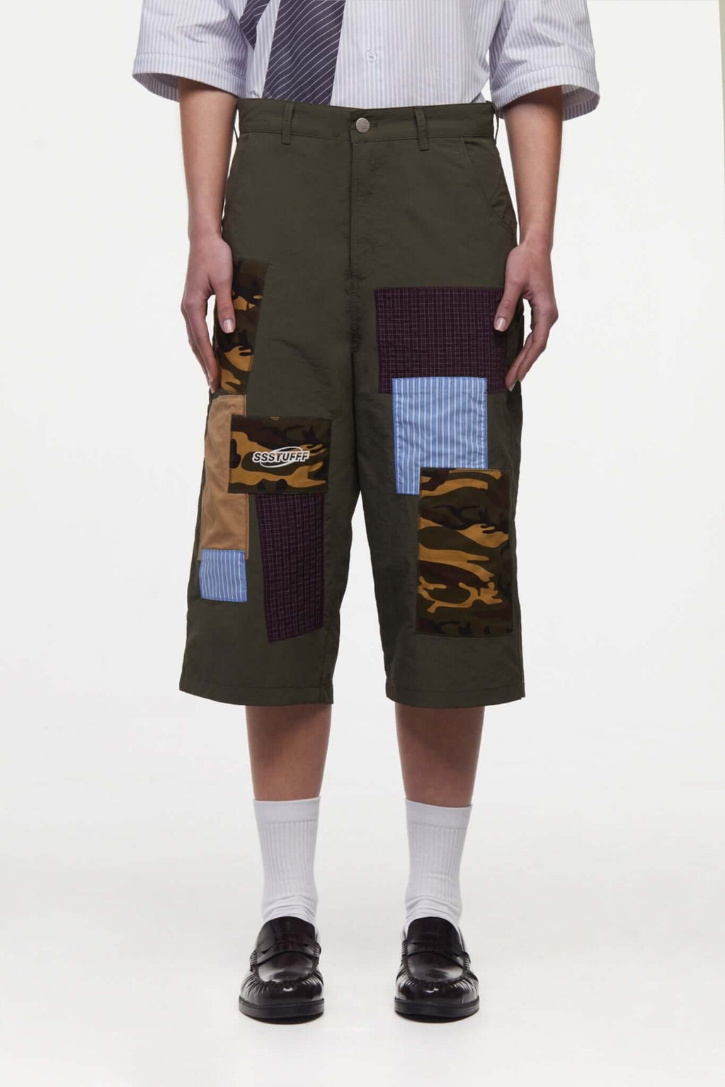 Green patchwork pants with various patterns 
