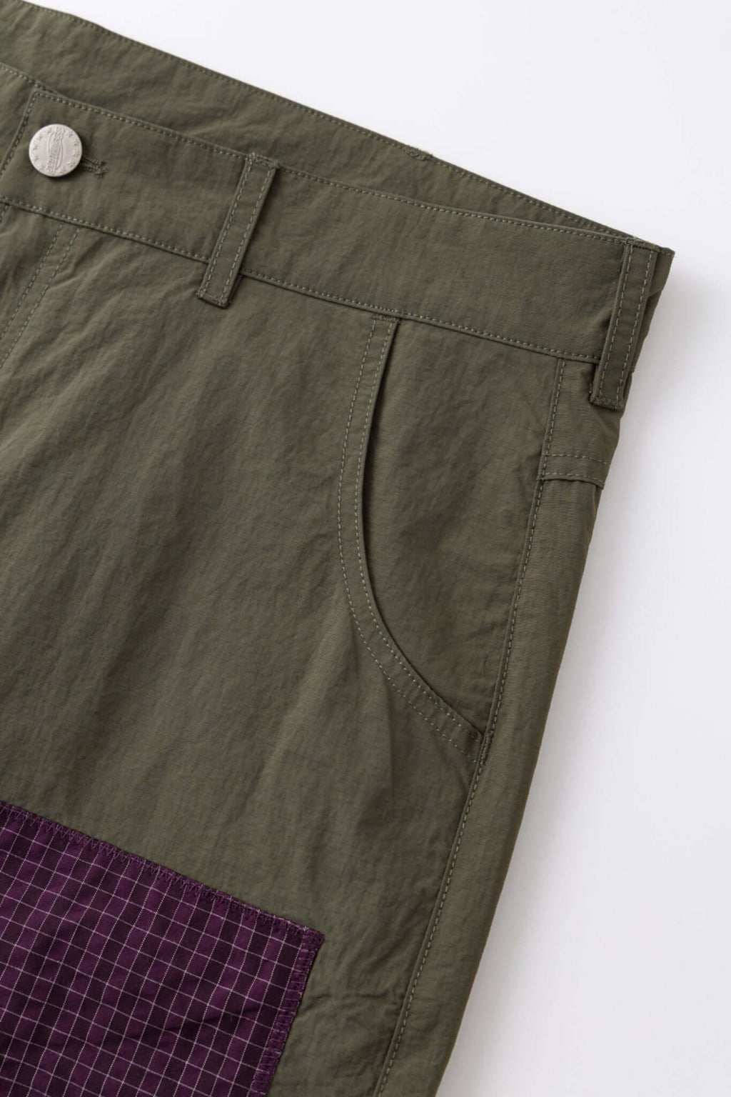 Green patchwork pants with various patterns 
