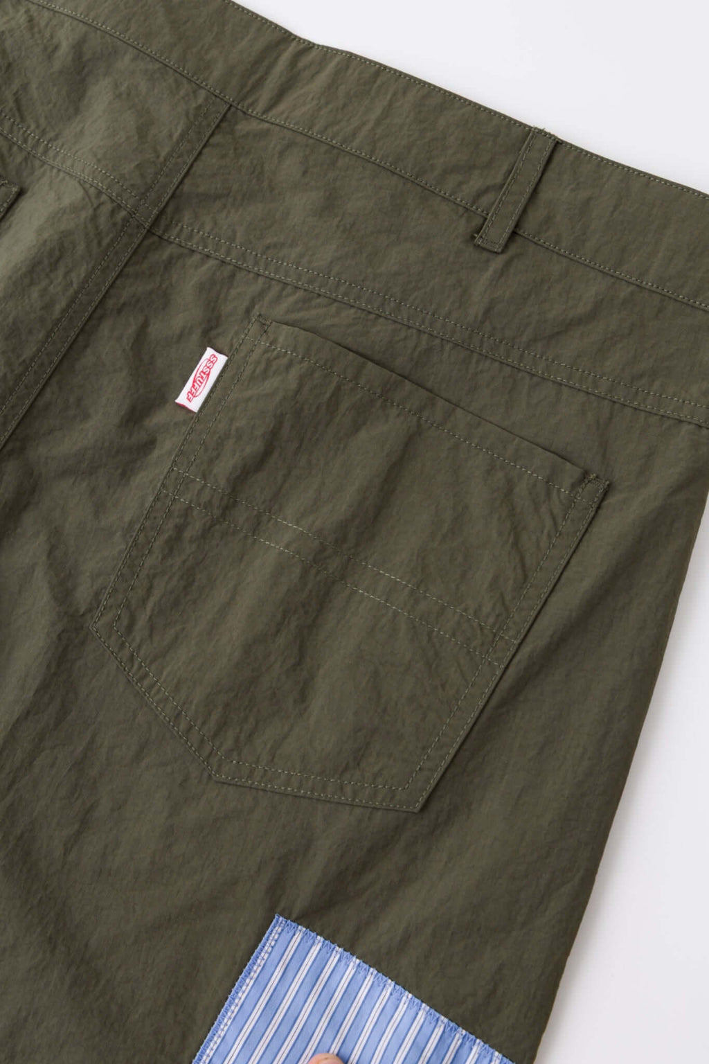 Green patchwork pants with various patterns 
