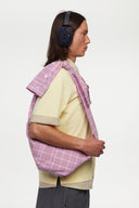 Pink plaid bag with a strap simulating a shirt
