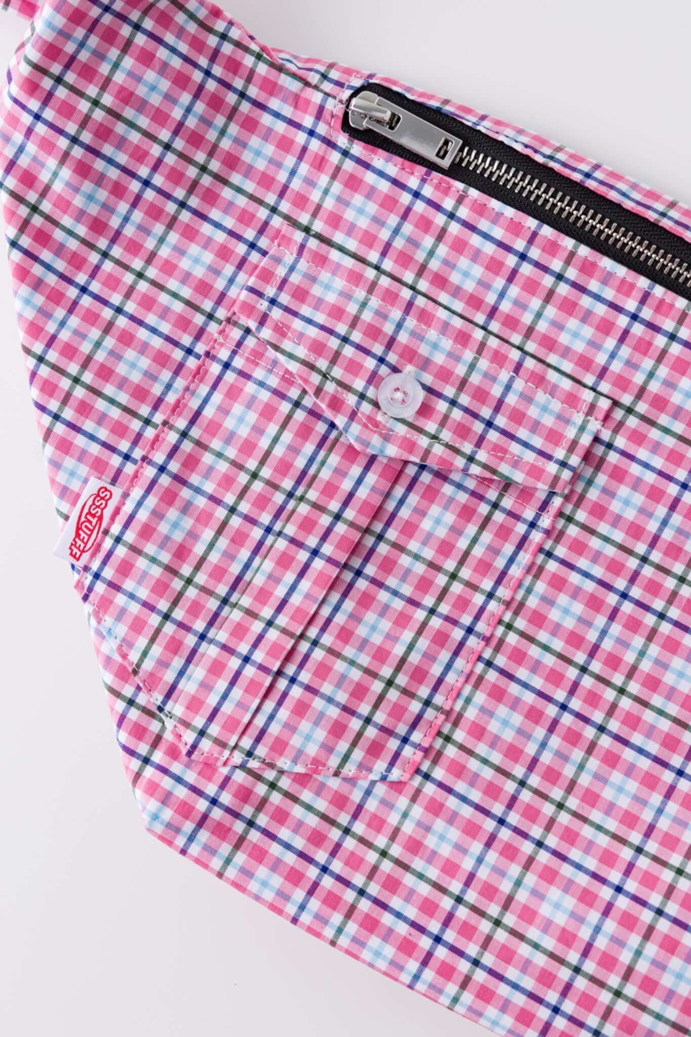 Pink plaid bag with a strap simulating a shirt
