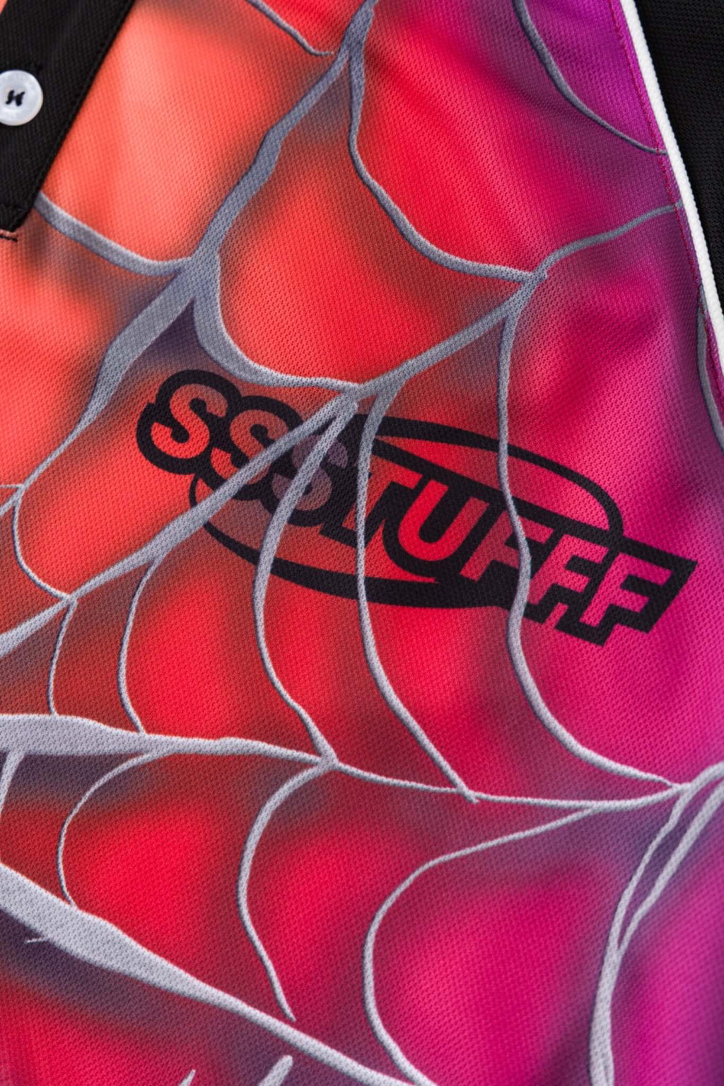 Black jersey shirt with a colorful spider web design with the word SSSTUFFF on it

